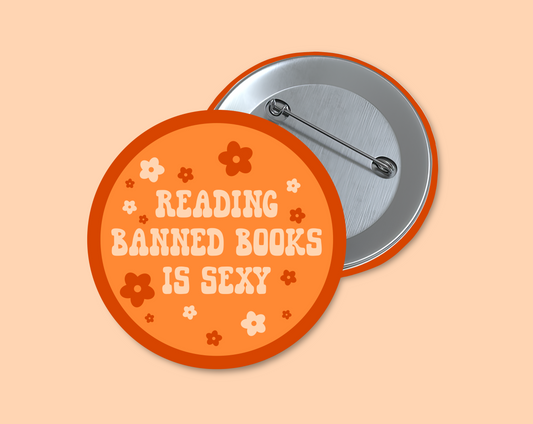 Reading banned books is sexy round 1.5 inch buttons